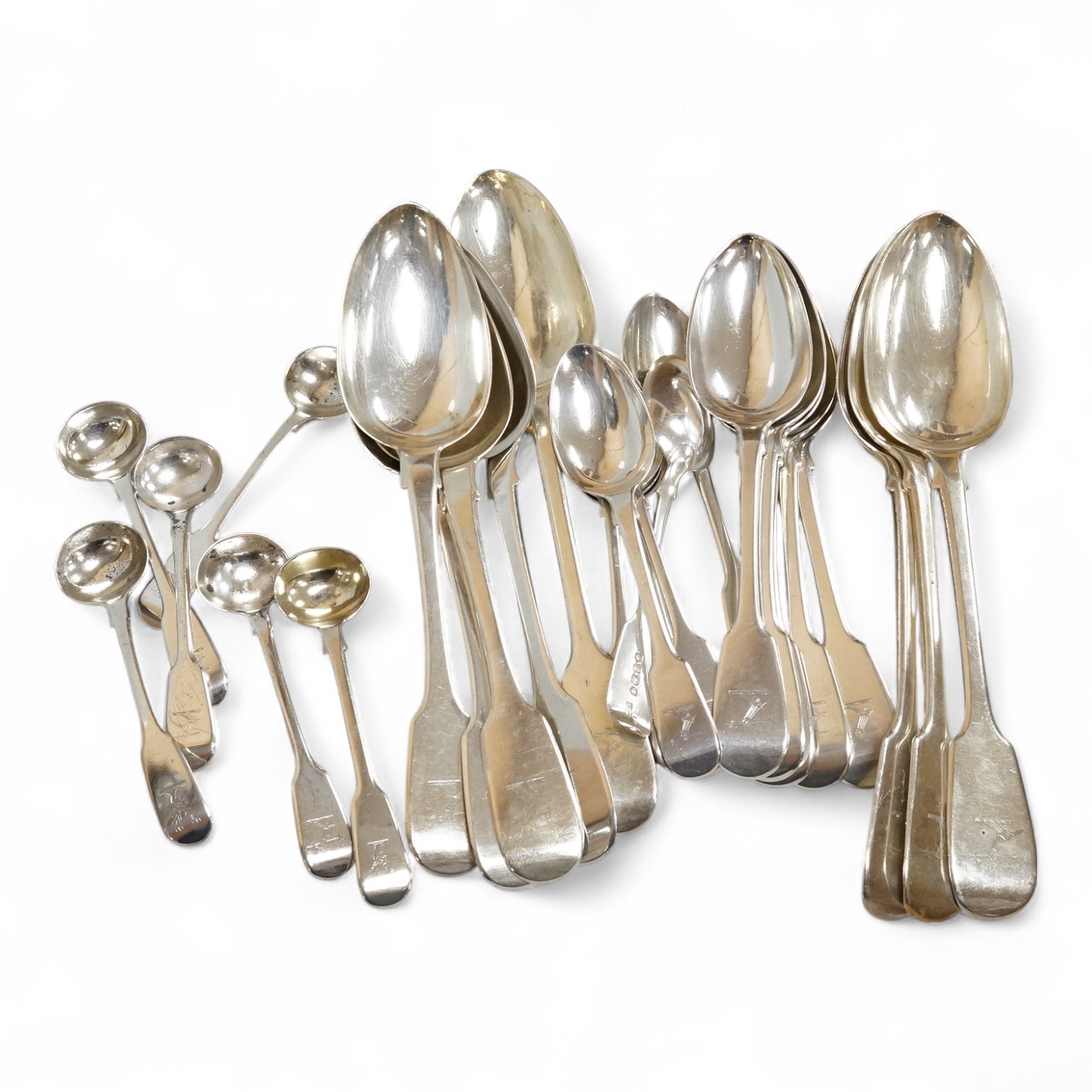 A harlequin part canteen of 19th century silver fiddle pattern flatware, comprising twenty six items, all with engraved crest various dates and makers, 32.3oz.